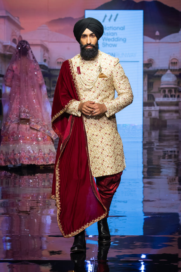 GOLD SHERWANI WITH MAROON TOUCHING